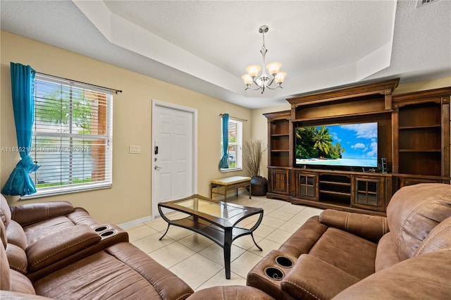 604 SW 107th Ave Unit 706, Pembroke Pines, FL 33025 - living area with a tray ceiling, a chandelier, and light tile patterned floors