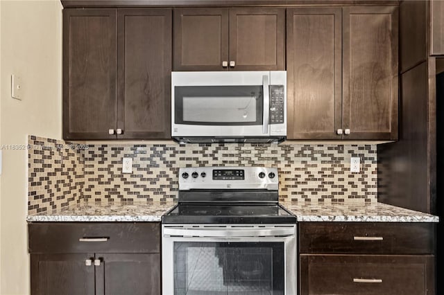 604 SW 107th Ave Unit 706, Pembroke Pines, FL 33025 - kitchen featuring appliances with stainless steel finishes, dark brown cabinetry, and decorative backsplash