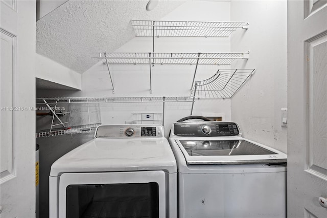 604 SW 107th Ave Unit 706, Pembroke Pines, FL 33025 - laundry room with washer and clothes dryer and a textured ceiling
