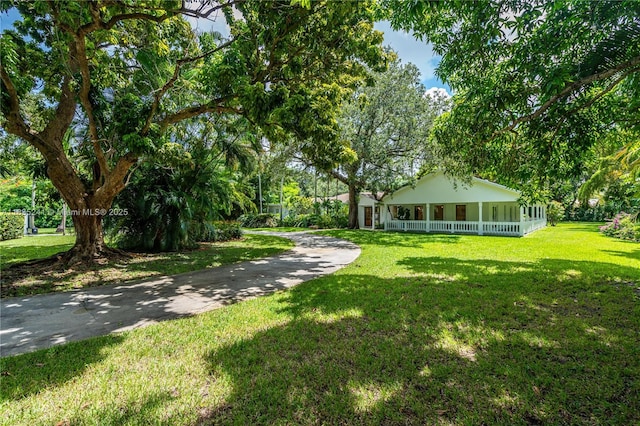 10821 SW 92nd Ave, Miami, FL 33176 - view of green lawn featuring covered porch