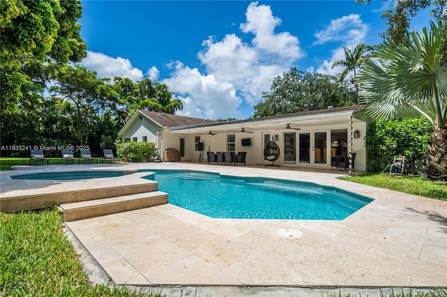 10821 SW 92nd Ave, Miami, FL 33176 - swimming pool with a ceiling fan, a patio, and french doors