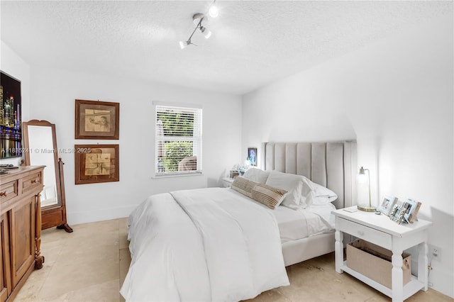 10821 SW 92nd Ave, Miami, FL 33176 - bedroom with a textured ceiling and rail lighting