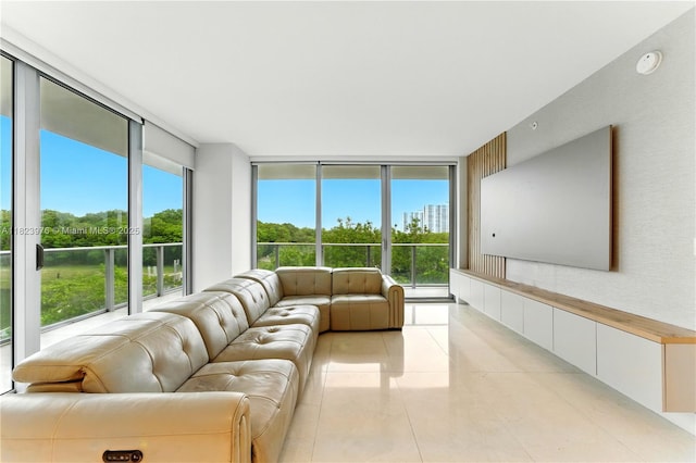 16385 Biscayne Blvd Unit 301, North Miami Beach, FL 33160 - living area featuring floor to ceiling windows, healthy amount of natural light, and light tile patterned floors