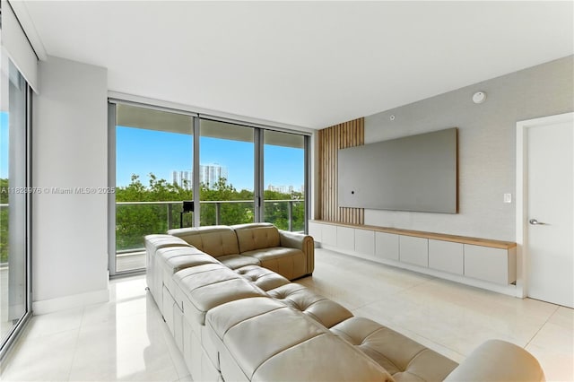 16385 Biscayne Blvd Unit 301, North Miami Beach, FL 33160 - living area featuring light tile patterned flooring and expansive windows