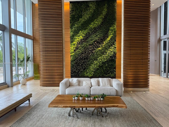 16385 Biscayne Blvd Unit 301, North Miami Beach, FL 33160 - building lobby featuring a wall of windows and a towering ceiling