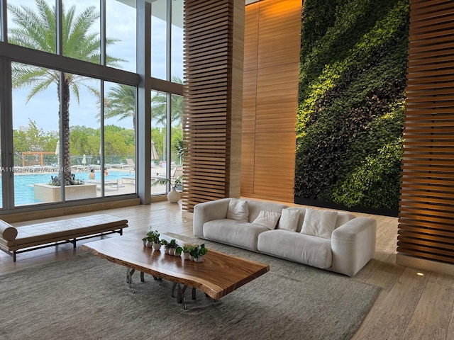 16385 Biscayne Blvd Unit 301, North Miami Beach, FL 33160 - living room with wood finished floors and a wall of windows