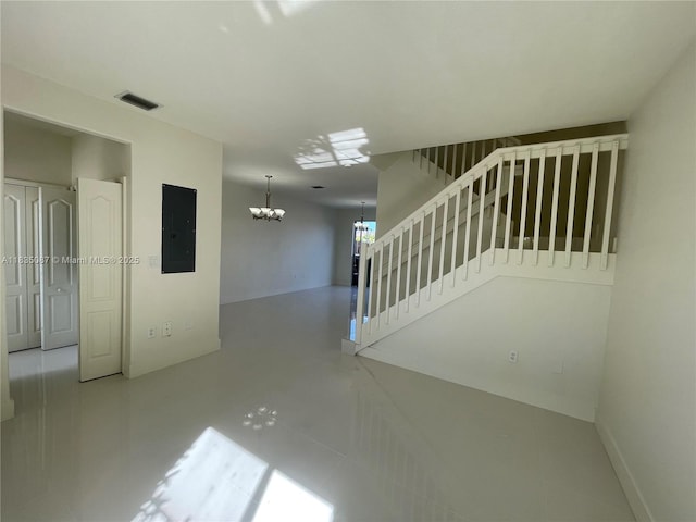 7317 NW 174th Ter Unit 102, Hialeah, FL 33015 - unfurnished room featuring electric panel, a chandelier, and stairway