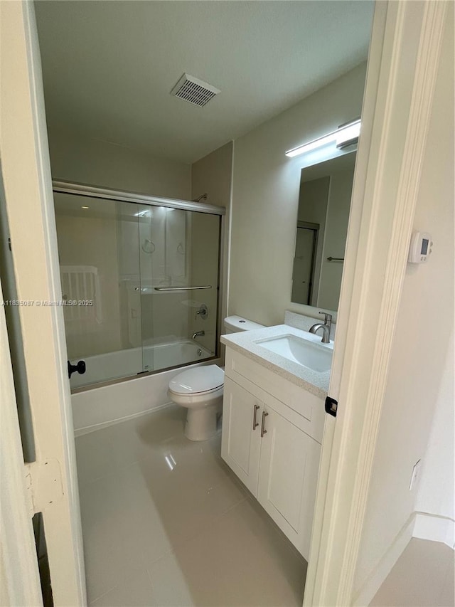 7317 NW 174th Ter Unit 102, Hialeah, FL 33015 - bathroom featuring vanity, shower / bath combination with glass door, and tile patterned flooring