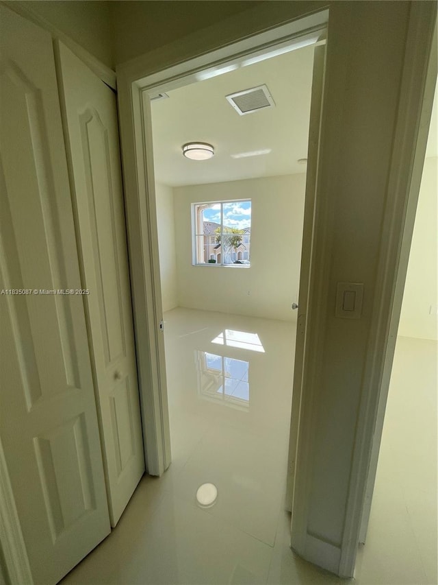 7317 NW 174th Ter Unit 102, Hialeah, FL 33015 - hallway featuring light tile patterned floors