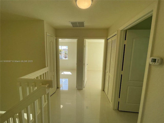 7317 NW 174th Ter Unit 102, Hialeah, FL 33015 - corridor with light tile patterned floors and an upstairs landing