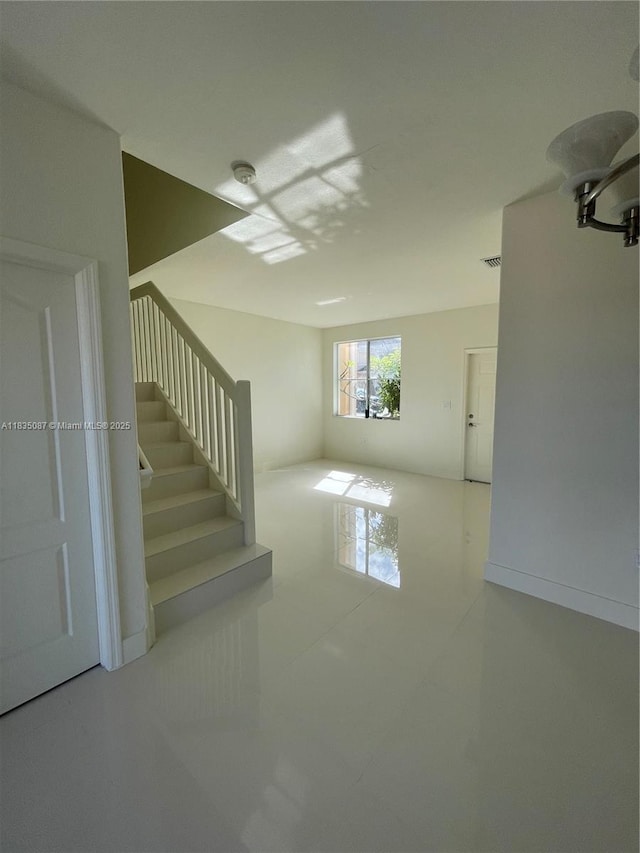 7317 NW 174th Ter Unit 102, Hialeah, FL 33015 - basement with stairs and tile patterned flooring