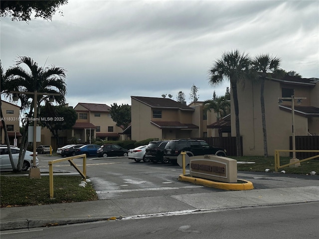 311 W Park Dr Unit 101-13, Miami, FL 33172 - uncovered parking lot featuring a residential view