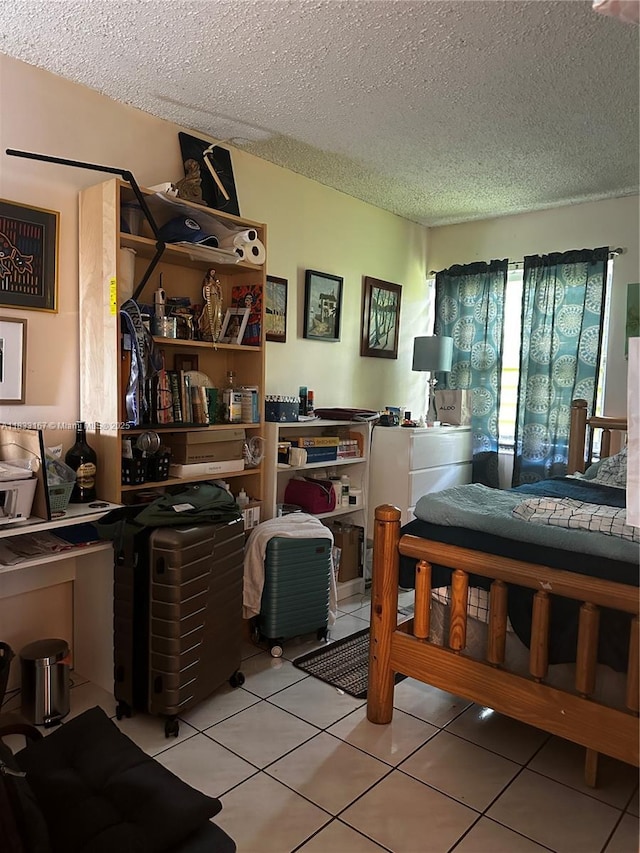 311 W Park Dr Unit 101-13, Miami, FL 33172 - bedroom with a textured ceiling and light tile patterned floors