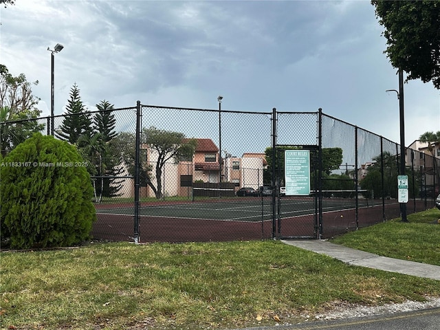 311 W Park Dr Unit 101-13, Miami, FL 33172 - view of tennis court with a gate
