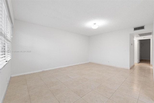 800 SW 131st Ave Unit 406F, Pembroke Pines, FL 33027 - unfurnished room with a textured ceiling and light tile patterned floors