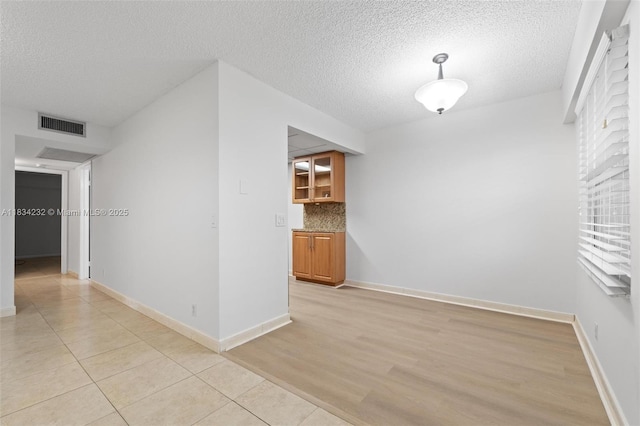800 SW 131st Ave Unit 406F, Pembroke Pines, FL 33027 - spare room with a textured ceiling and light tile patterned flooring