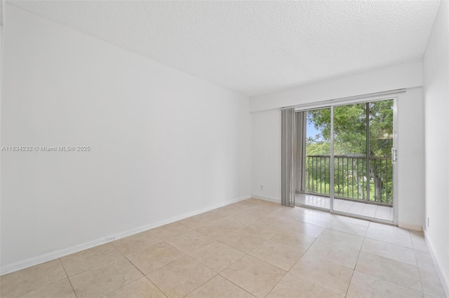 800 SW 131st Ave Unit 406F, Pembroke Pines, FL 33027 - spare room with a textured ceiling and light tile patterned flooring