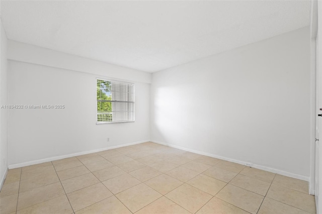 800 SW 131st Ave Unit 406F, Pembroke Pines, FL 33027 - empty room featuring light tile patterned flooring and baseboards