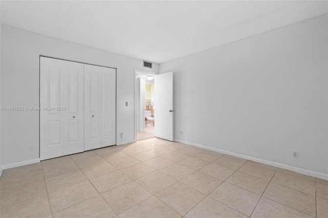 800 SW 131st Ave Unit 406F, Pembroke Pines, FL 33027 - unfurnished bedroom with a closet and light tile patterned floors