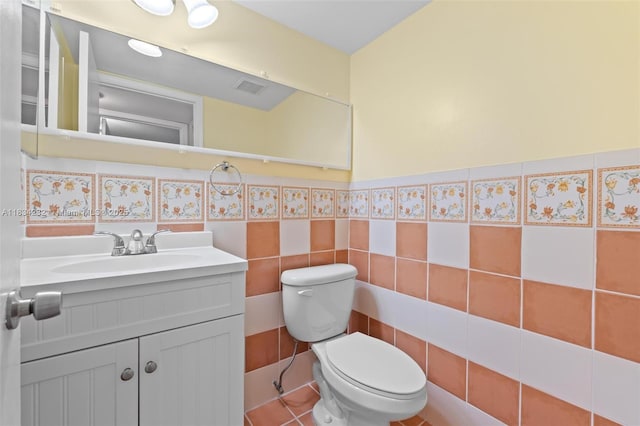 800 SW 131st Ave Unit 406F, Pembroke Pines, FL 33027 - half bath with vanity, tile walls, and a wainscoted wall