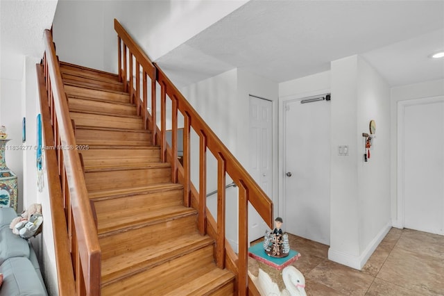 8256 NW 9th Ct Unit 2, Plantation, FL 33324 - staircase featuring baseboards