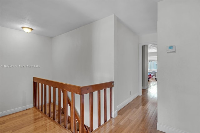8256 NW 9th Ct Unit 2, Plantation, FL 33324 - corridor featuring an upstairs landing and wood finished floors