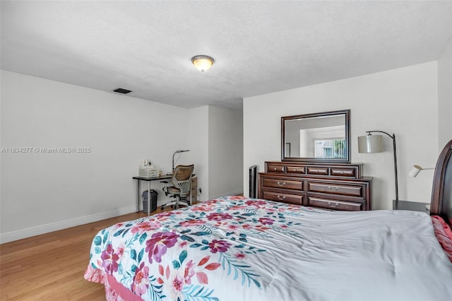 8256 NW 9th Ct Unit 2, Plantation, FL 33324 - bedroom featuring wood finished floors and baseboards
