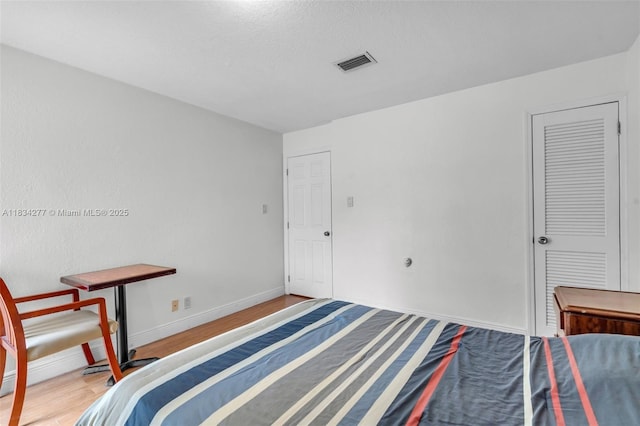 8256 NW 9th Ct Unit 2, Plantation, FL 33324 - bedroom featuring wood finished floors and baseboards