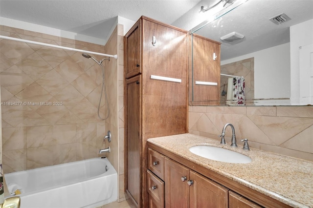 8256 NW 9th Ct Unit 2, Plantation, FL 33324 - bathroom featuring vanity, shower / bath combination with curtain, backsplash, and a textured ceiling