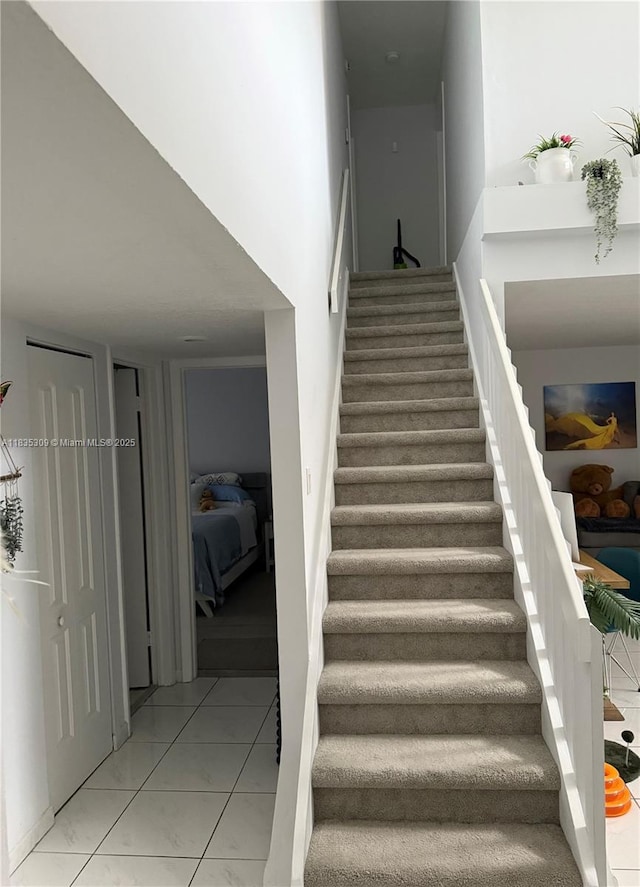 17048 NW 66th Ct, Miami Lakes, FL 33015 - stairs featuring marble look tile flooring