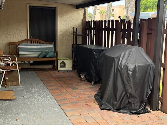 17048 NW 66th Ct, Miami Lakes, FL 33015 - view of patio with a grill
