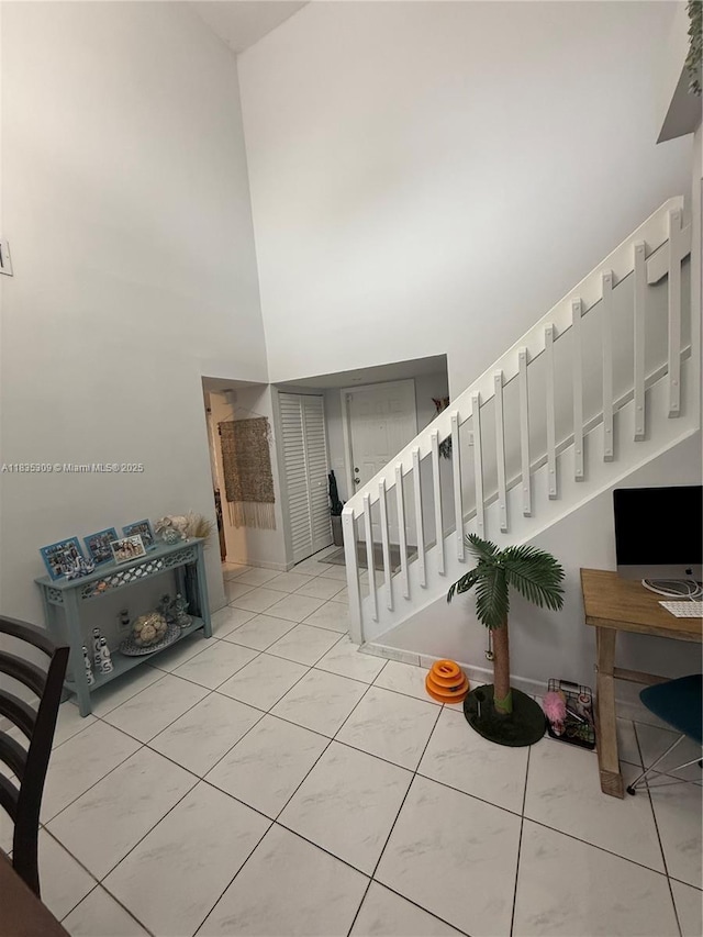 17048 NW 66th Ct, Miami Lakes, FL 33015 - stairs featuring a high ceiling and tile patterned floors