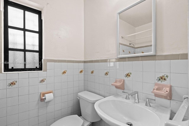 2025 SW 19th St, Miami, FL 33145 - bathroom featuring a shower, a wainscoted wall, and tile walls