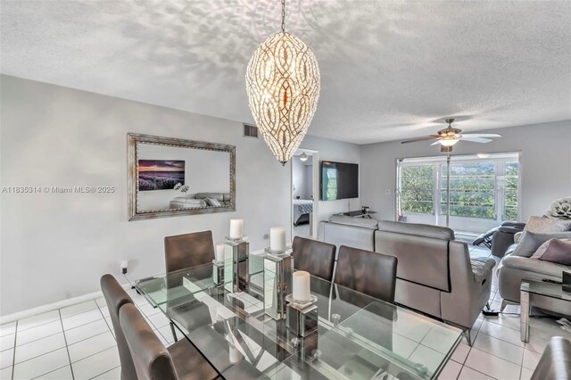 1300 SW 125th Ave Unit 406K, Pembroke Pines, FL 33027 - dining room with a textured ceiling, a chandelier, ceiling fan, and tile patterned flooring