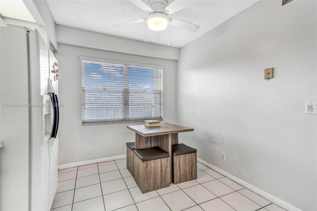 1300 SW 125th Ave Unit 406K, Pembroke Pines, FL 33027 - dining room with ceiling fan, a textured ceiling, and light tile patterned floors