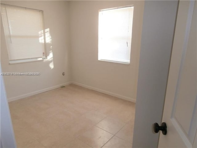 95 NE 41st St Unit O230, Oakland Park, FL 33334 - spare room featuring baseboards