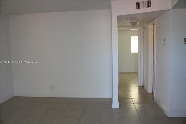 95 NE 41st St Unit O230, Oakland Park, FL 33334 - empty room with light tile patterned flooring and baseboards