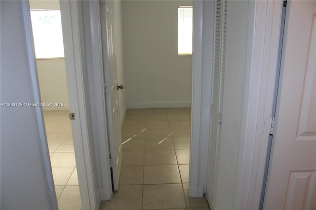 101 NE 41st St Unit F107, Oakland Park, FL 33334 - hallway with light tile patterned floors and baseboards