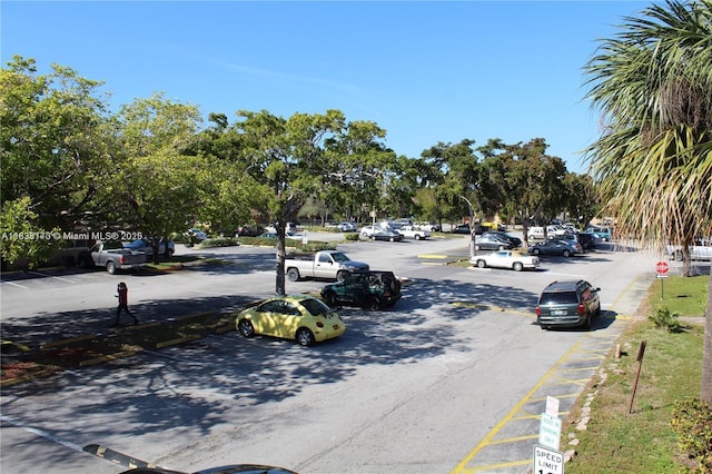 101 NE 41st St Unit F107, Oakland Park, FL 33334 - view of asphalt street featuring traffic signs and curbs