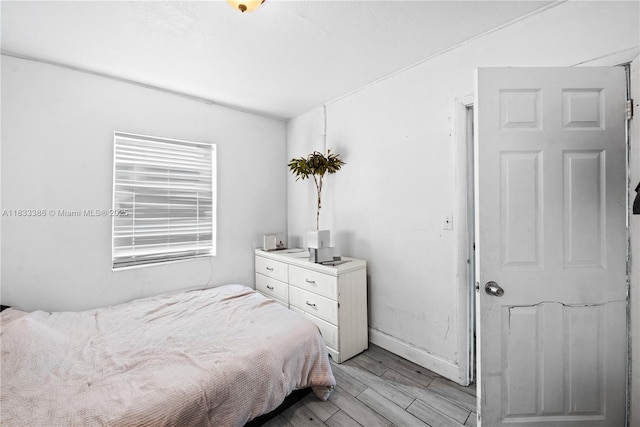 1200 NW 11th Ct, Fort Lauderdale, FL 33311 - bedroom with light wood-style floors and baseboards