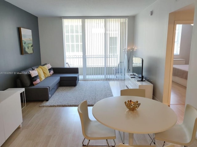 400 N Federal Hwy Unit 305S, Boynton Beach, FL 33435 - living room featuring light wood-type flooring and floor to ceiling windows