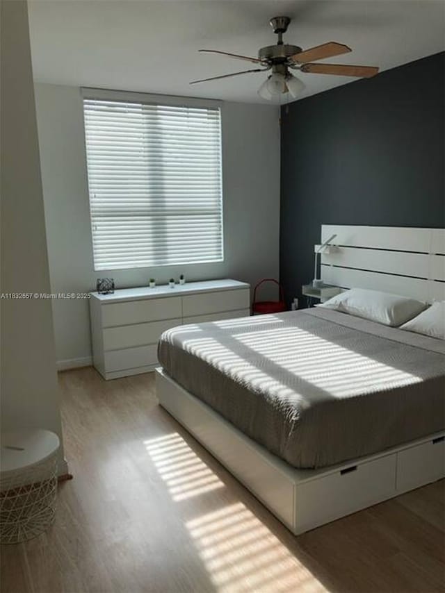 400 N Federal Hwy Unit 305S, Boynton Beach, FL 33435 - bedroom with light wood finished floors and ceiling fan