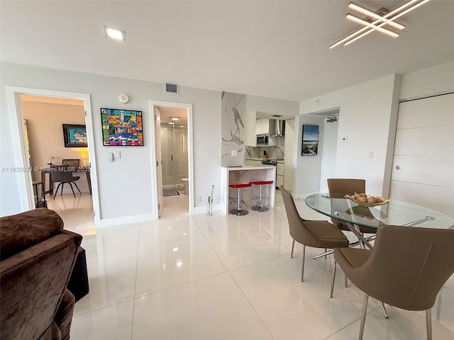 20379 W Country Club Dr Unit 1434, Aventura, FL 33180 - dining room with light tile patterned floors and baseboards