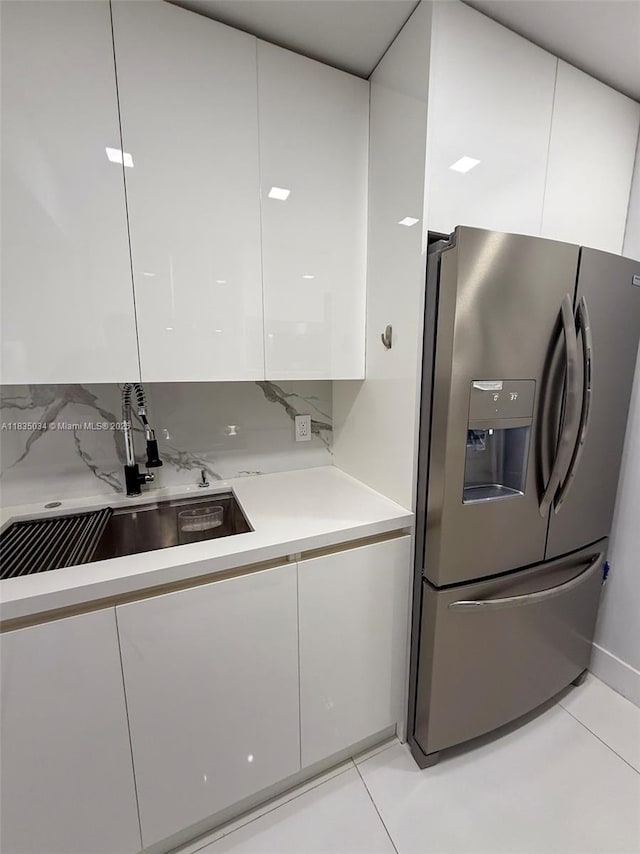 20379 W Country Club Dr Unit 1434, Aventura, FL 33180 - kitchen featuring stainless steel fridge, modern cabinets, and white cabinetry