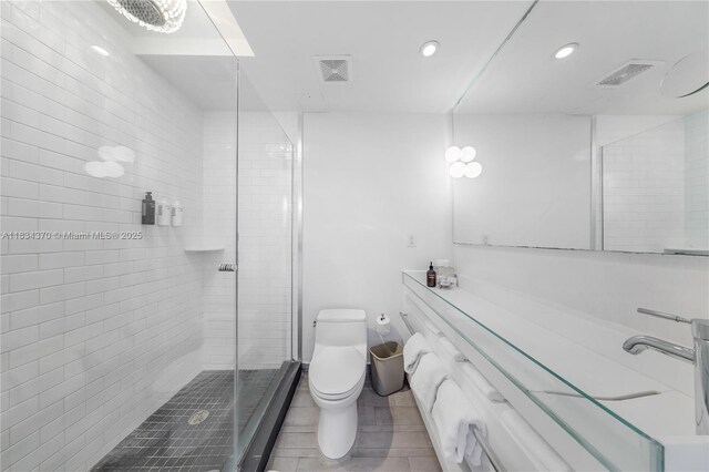 1100 W Ave Unit 1614, Miami Beach, FL 33139 - bathroom with vanity, recessed lighting, a stall shower, and tile patterned floors