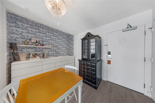 1100 W Ave Unit 1614, Miami Beach, FL 33139 - dining area with a chandelier, wood finished floors, wallpapered walls, and recessed lighting