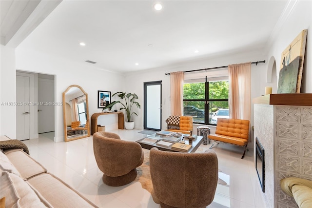 2485 SW 19th Ter, Miami, FL 33145 - living area featuring light tile patterned floors, recessed lighting, ornamental molding, and a fireplace