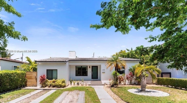 2485 SW 19th Ter, Miami, FL 33145 - view of front facade with stucco siding and a chimney