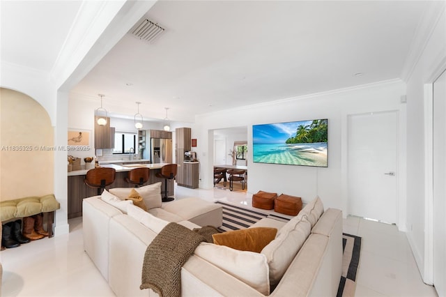 2485 SW 19th Ter, Miami, FL 33145 - living room featuring light tile patterned floors and crown molding