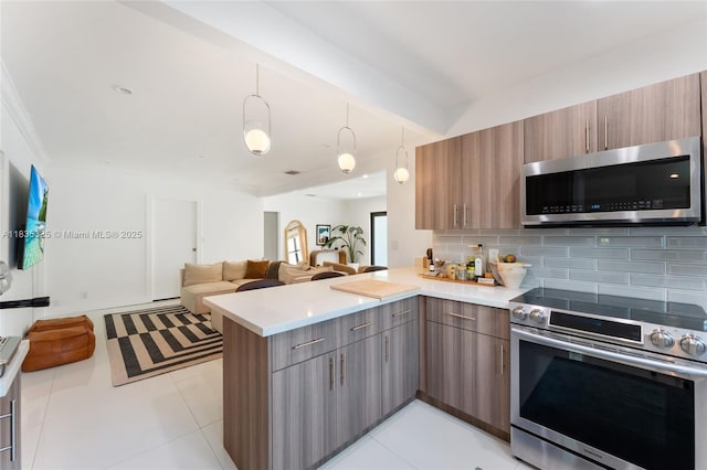 2485 SW 19th Ter, Miami, FL 33145 - kitchen with appliances with stainless steel finishes, a peninsula, and modern cabinets